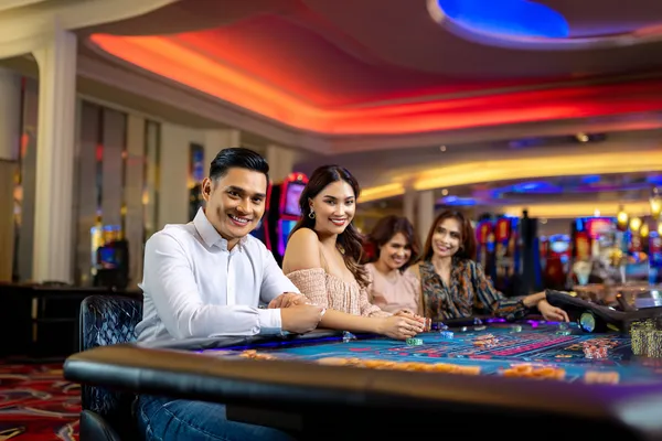 A glamorous woman holding casino chips in a neon-lit environment, representing the premium online casino atmosphere of RK888.