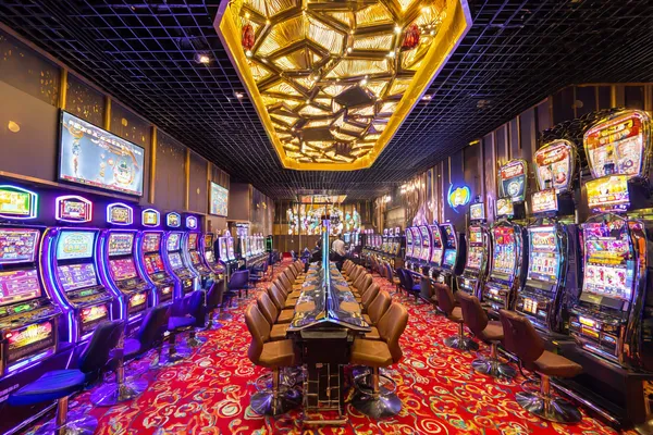 A close-up shot of golden coins falling around a spinning roulette wheel, representing immersive casino action at RK888.